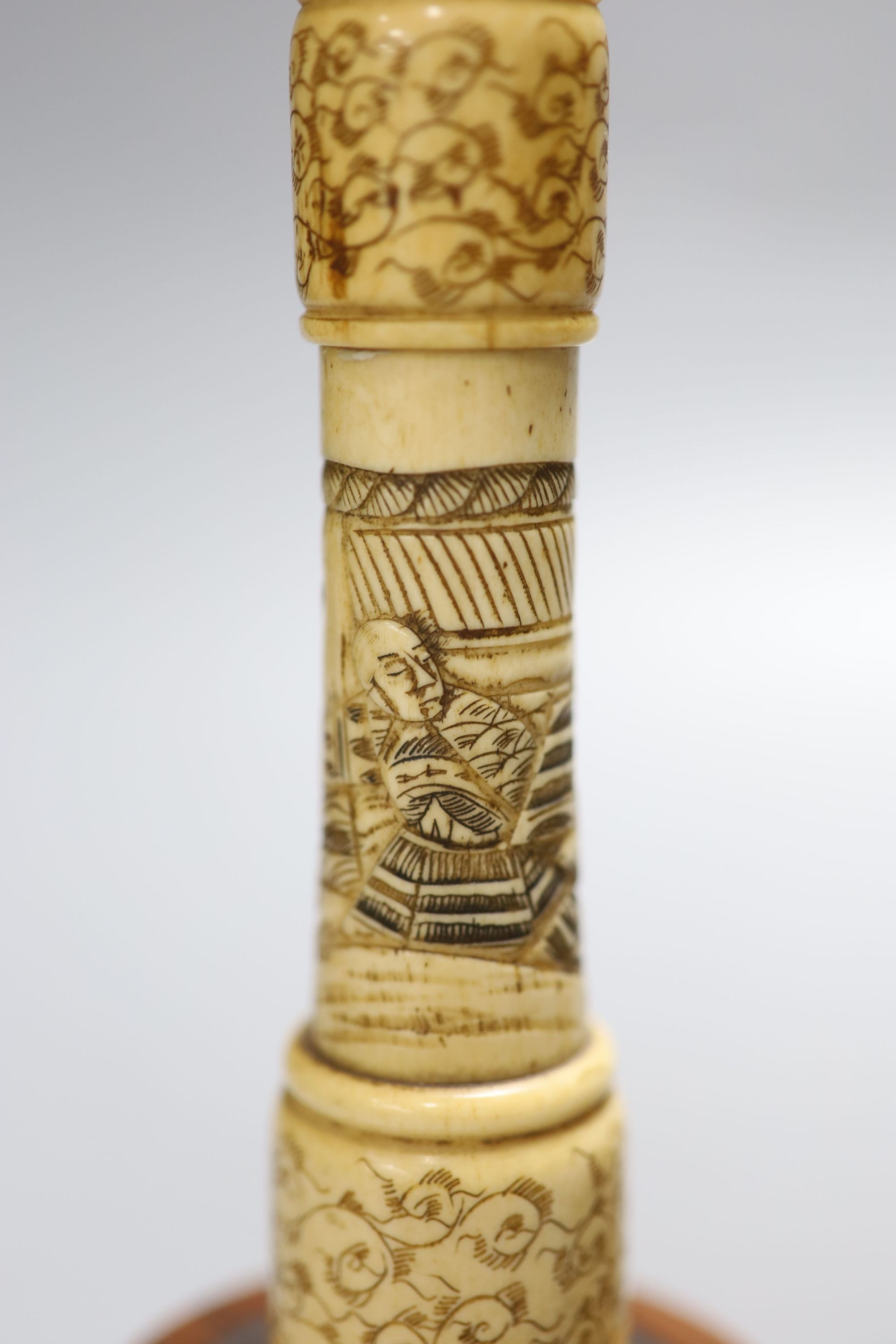 A pair of carved bone candlesticks, Meiji period, height 25cm